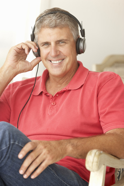 Mid age man wearing headphones - Fotó, kép