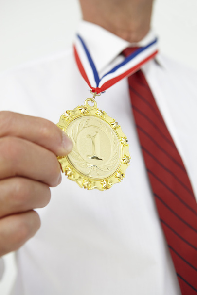 Businessman wearing medal - Фото, зображення