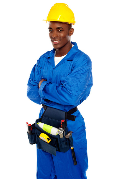 Smiling african worker posing with arms crossed - Foto, immagini