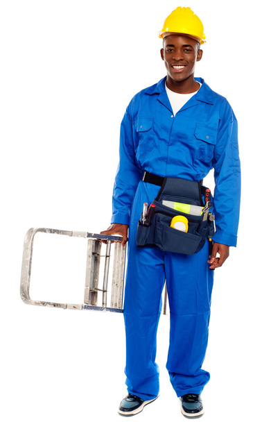 African repairman holding stepladder - Фото, зображення