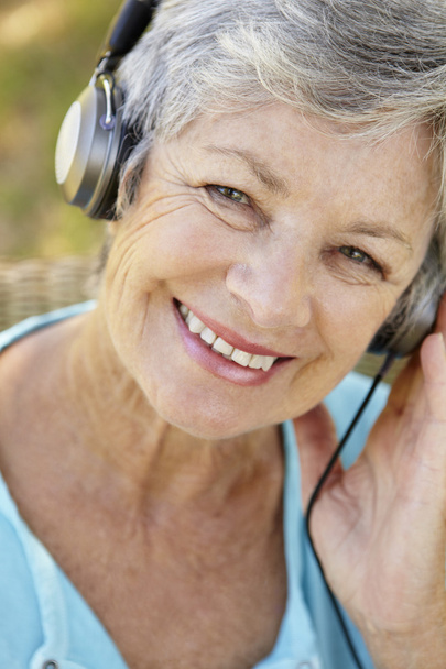 Senior woman with headphone - Photo, image