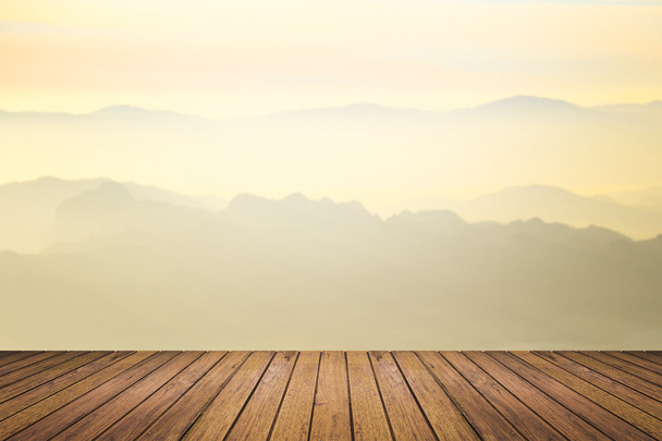 wooden floor with mountain blurred background - Photo, Image