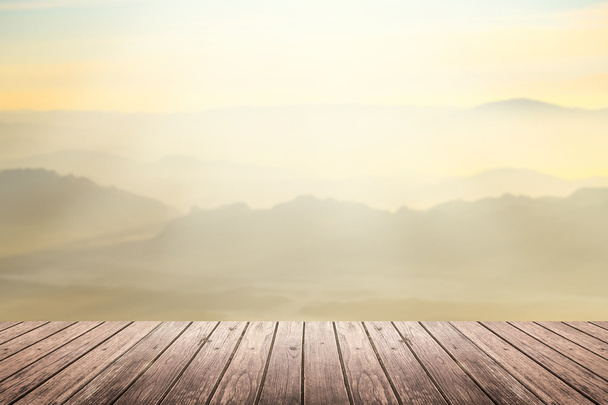 wooden floor with mountain blurred background - Photo, image