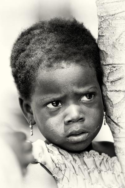 A Benin little girl watches attentively - Photo, image