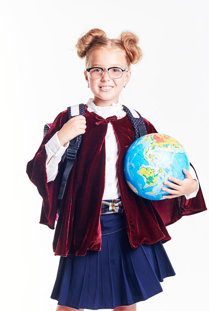 education and school concept - little student girl studying geography with globe and book - Fotoğraf, Görsel