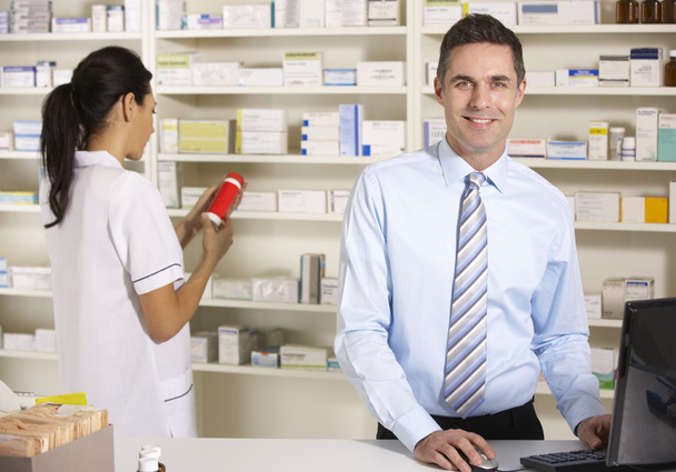 UK nurse and pharmacist working in pharmacy - Photo, image