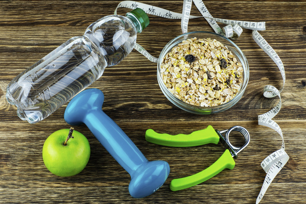 Fitness concept with dumbbell and healthy food. Copy space.  - Foto, Bild