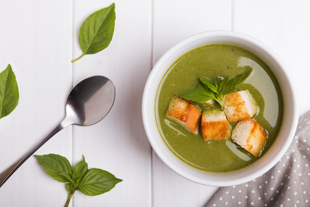 Green healthy cream soup on white background - Fotó, kép