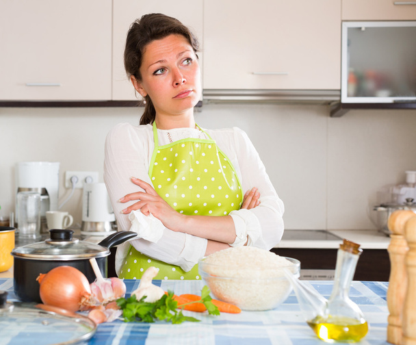 Sad housewife cooking dinne - Фото, зображення