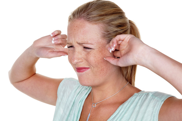 Woman holding fingers in their ears - Photo, Image