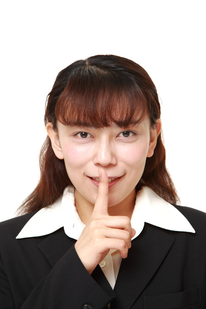 Asian businesswoman whith silence gestures - Foto, imagen