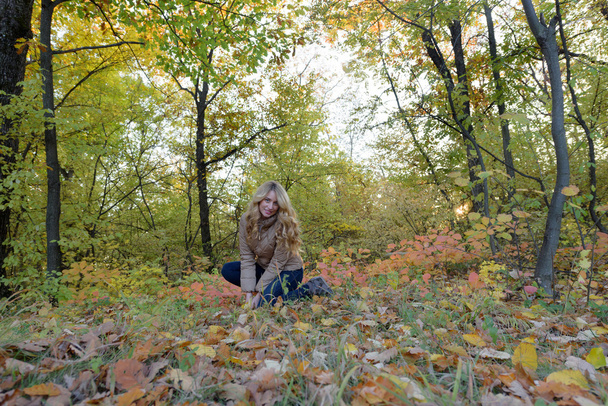 Happy Autumn girl in forest - Photo, Image