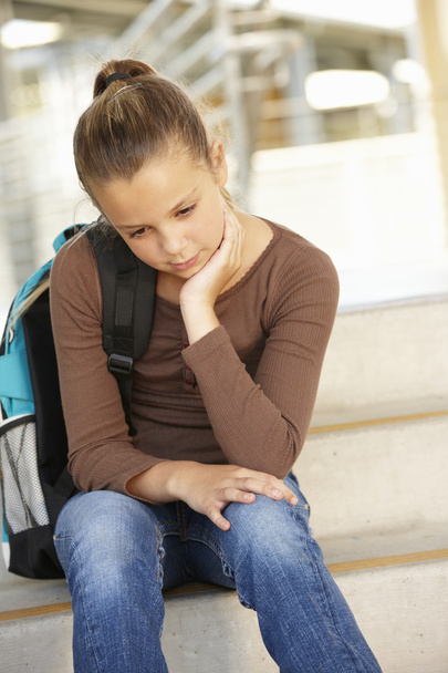 Unhappy Pre teen girl in school - Zdjęcie, obraz