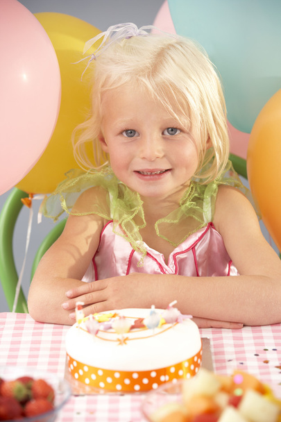 Young girl with birthday cake at party - Fotoğraf, Görsel