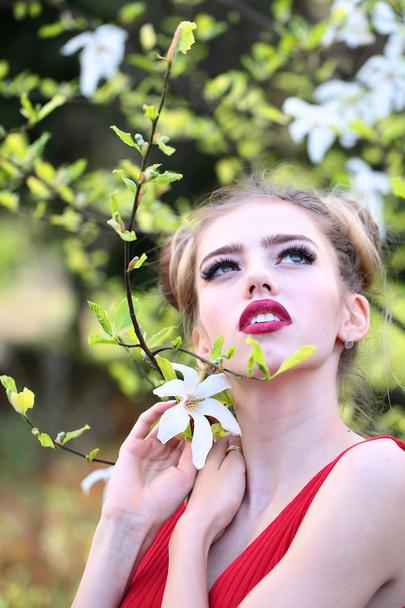 Attractive woman with spring tree - Photo, Image