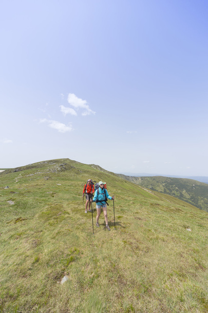 Summer hiking in the mountains with a backpack . - Fotó, kép