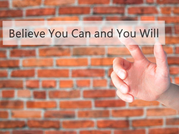 Believe You Can and You Will - Hand pressing a button on blurred - Photo, image