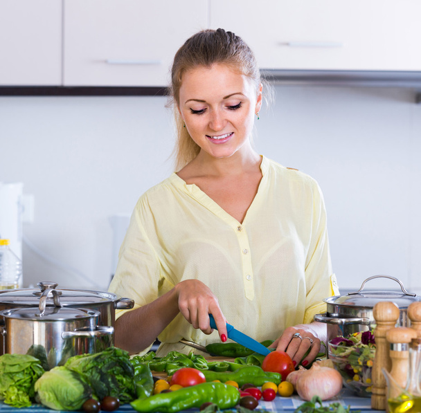 housewife cooking vegetables  - Фото, изображение