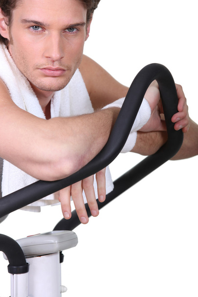 Man posing with an exercise machine - Fotó, kép