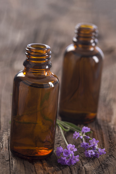 lavender oil in a glass bottle - Fotoğraf, Görsel