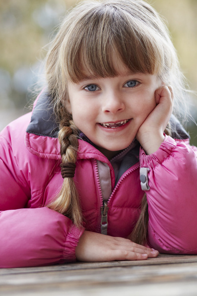 Outdoor Portrait Of Young Girl Wearing Winter Clothes - Foto, imagen