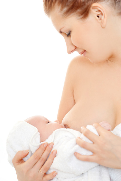 Mother breast feeding her infant - Foto, Imagen