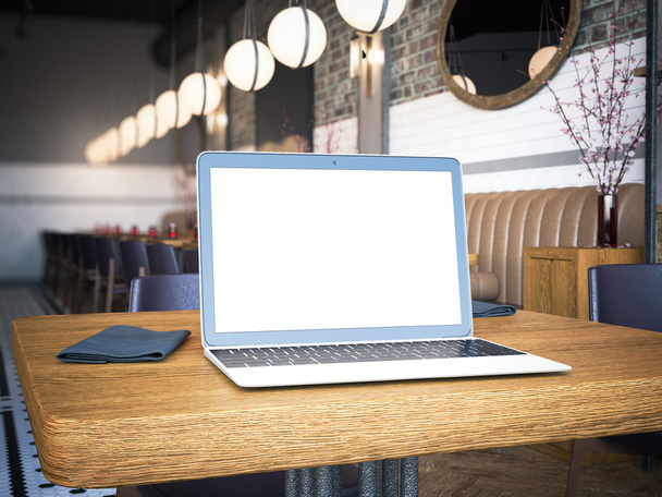 Laptop with blank screen on the cafe table. 3d rendering - Φωτογραφία, εικόνα