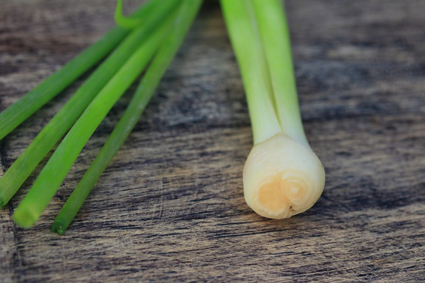 Fresh spring onions on wood - Photo, Image
