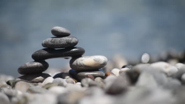 pebble tower against blue sea - Materiaali, video