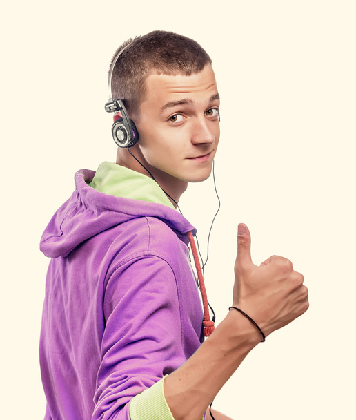 Guy using phone with headphones - Foto, Bild
