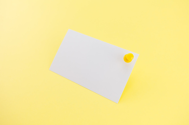 Blank business card with soft shadows on yellow background - Foto, Bild