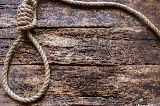 rope with a slipknot on the wooden background - Fotoğraf, Görsel