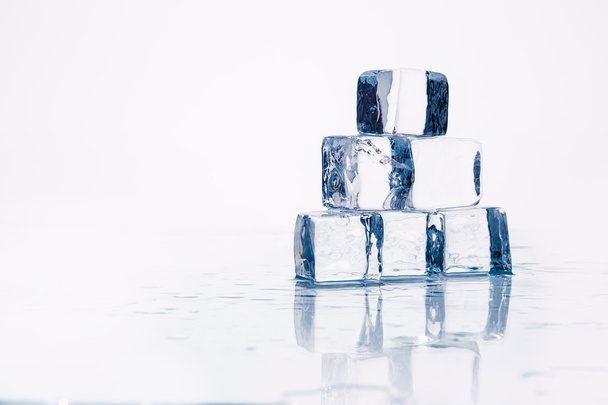 Ice cubes on table - Фото, изображение