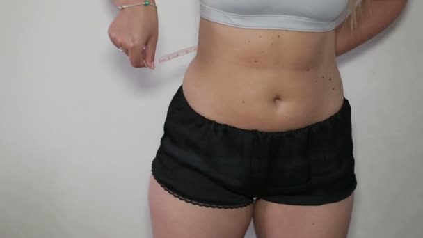 Woman measuring waist measuring tape - Footage, Video