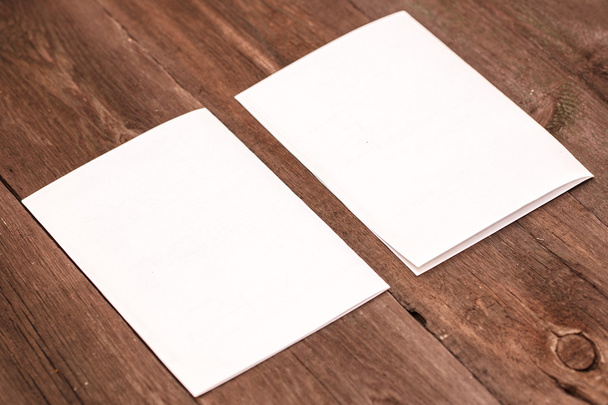 sheet of paper on a wooden background - Фото, зображення