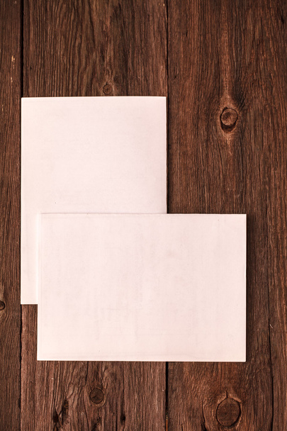 sheet of paper on a wooden background - Photo, image