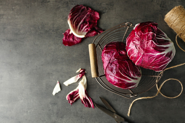 Fresh red cabbage on grey background - Фото, изображение