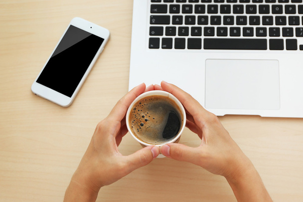 hands with laptop, phone and cup of coffee  - Foto, Imagen