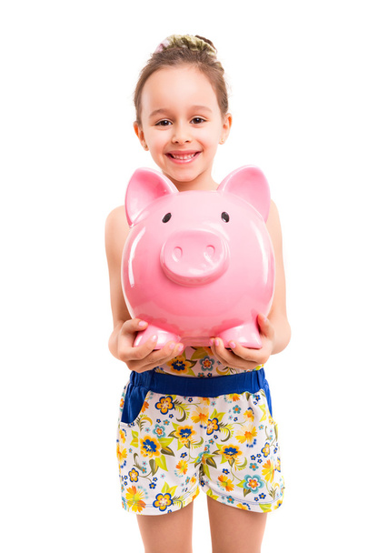 Happy girl with a new piggy bank  - Фото, изображение