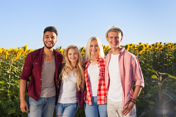 People group friends outdoor countryside sunflowers field - Photo, Image