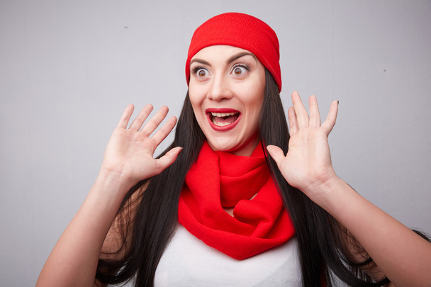 Brunette in red scarf and hat  - Zdjęcie, obraz