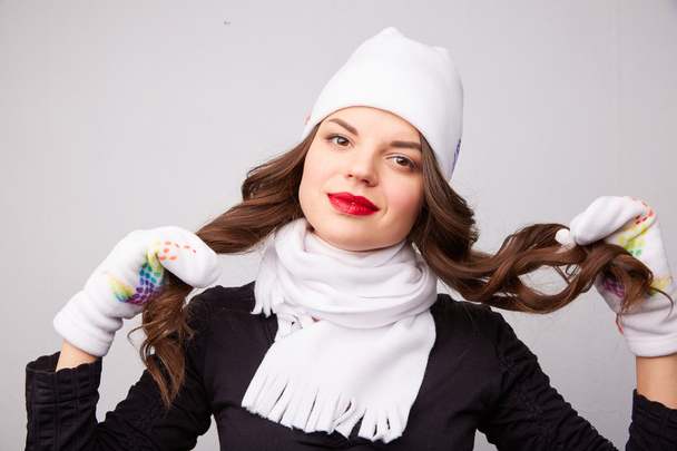 Beautiful girl in white hat and scarf - Фото, изображение