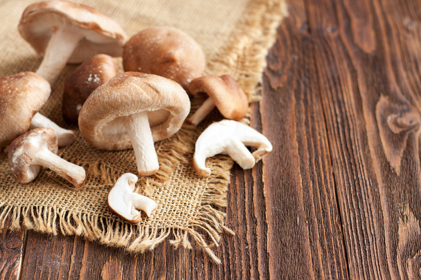 Shiitake mushrooms on wooden table - Photo, Image