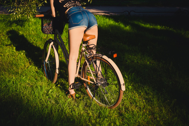 Beautiful blonde woman with bicycle - Fotoğraf, Görsel