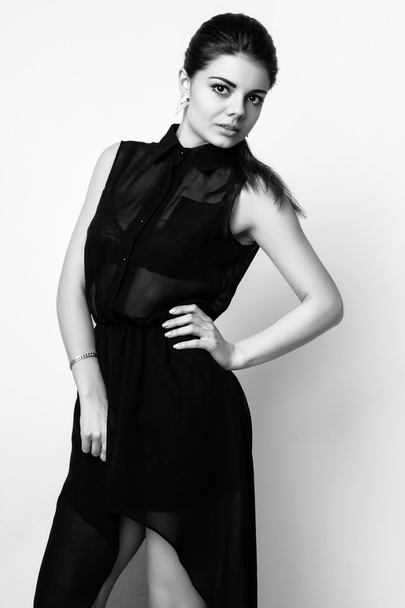 fashion style studio photo of a cute brunette, isolated on white background. Black and white photo - Photo, Image
