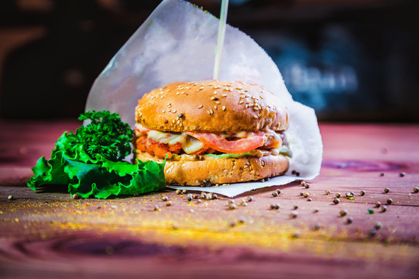 hamburger on a wooden background, fast food restaurant - Foto, immagini