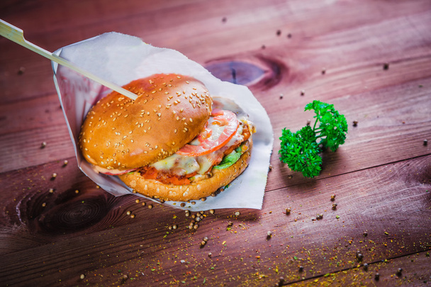 hamburger on a wooden background, fast food restaurant - Foto, immagini