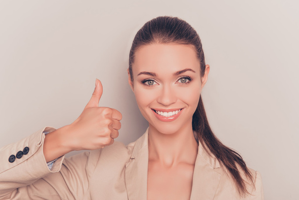 Cheerful happy young businesswoman showing thumb up - Photo, Image
