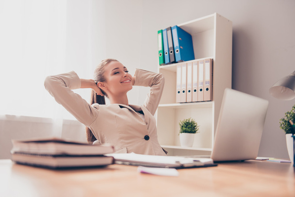 Happy relaxed woman having break and resting in office - Фото, изображение