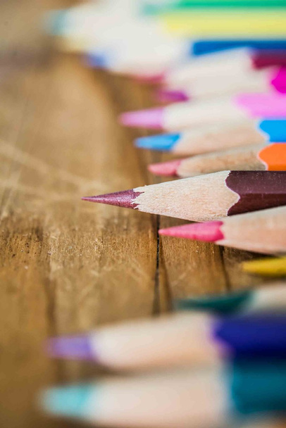 Color pencils  on wooden background. - Φωτογραφία, εικόνα